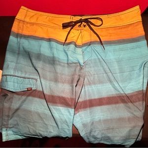 Orange and blue swimming trunks